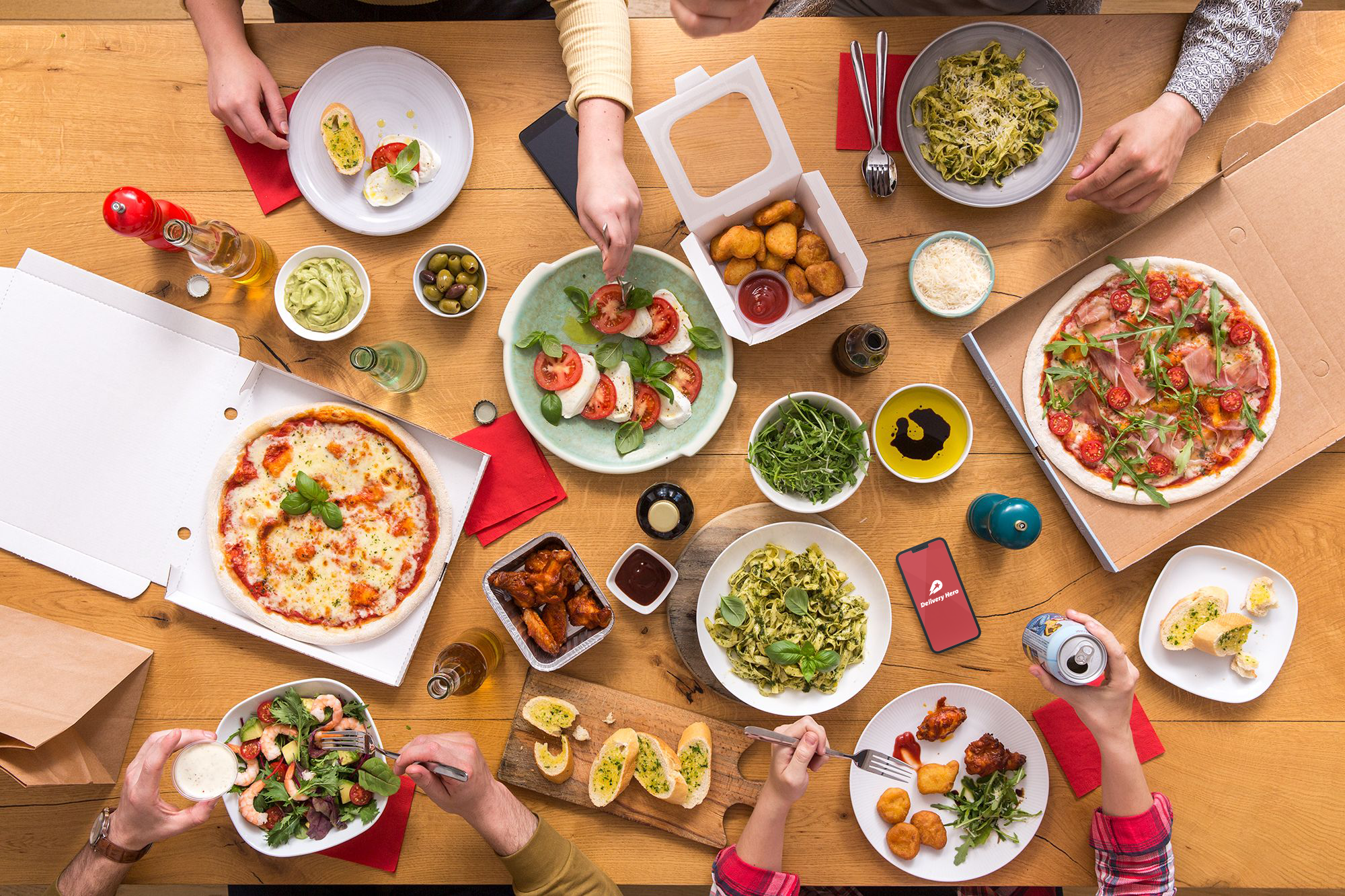 People sharing delivered food.