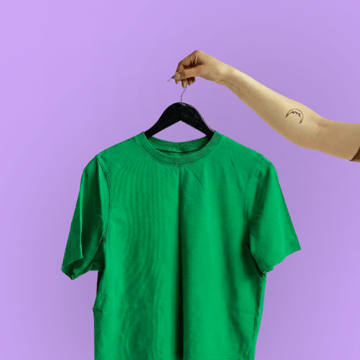 A green t-shirt on a hanger.